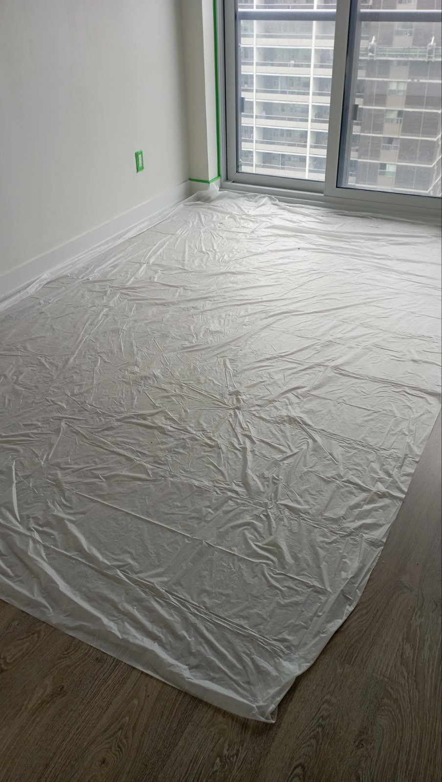 Condo unit floor masked for paint