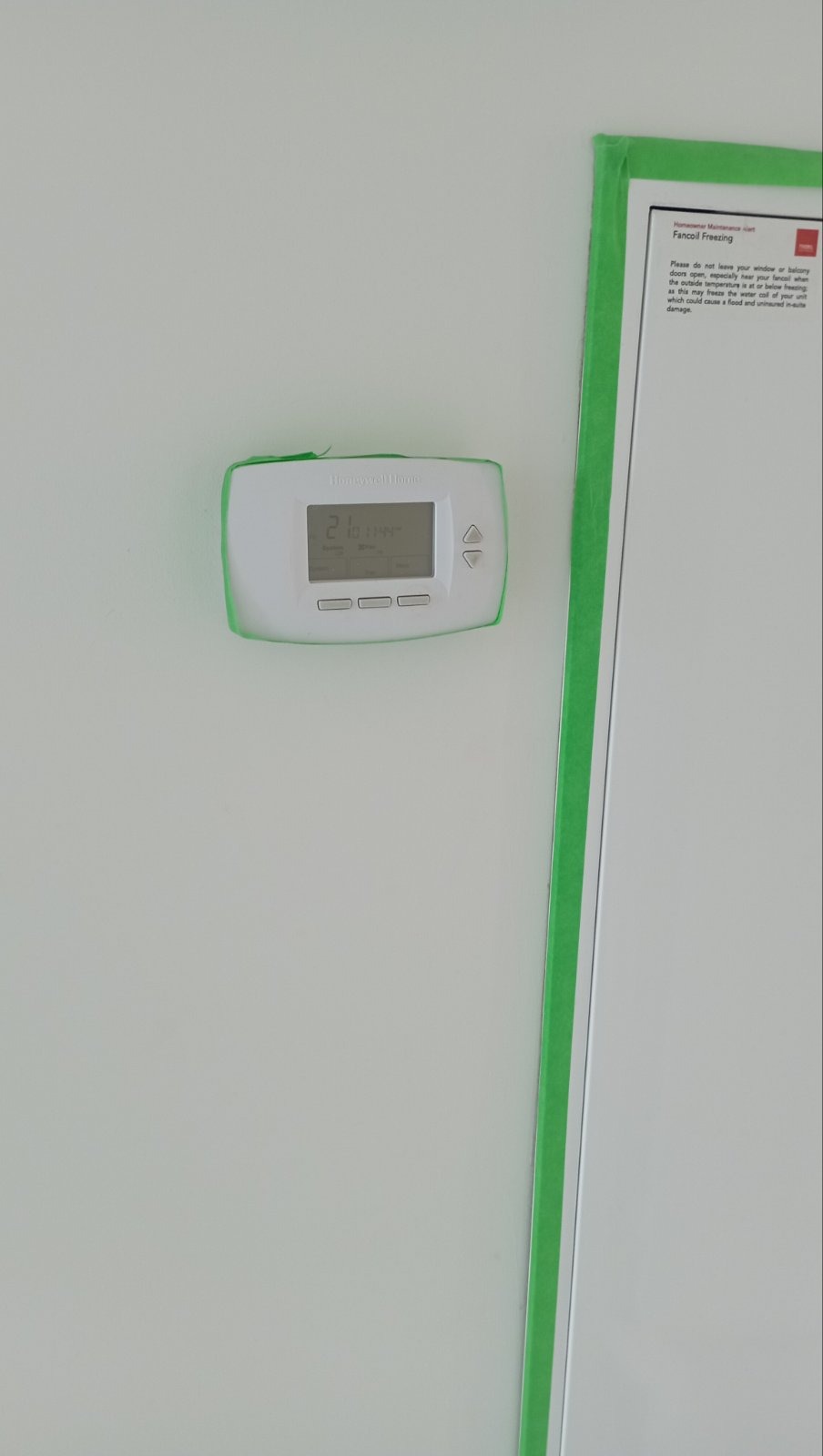 Thermostat carefully masked with green painter's tape